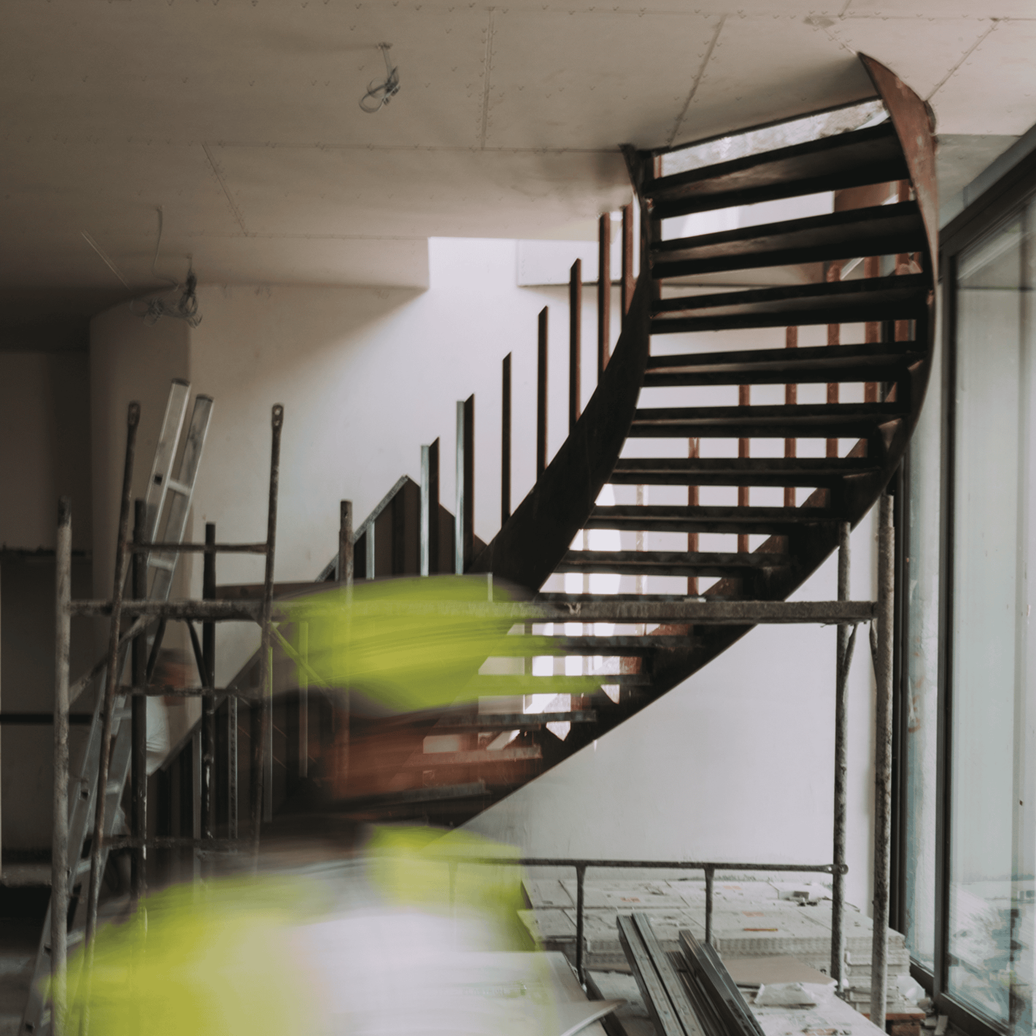 APT.401 during construction, with a steel stair and scaffolding.